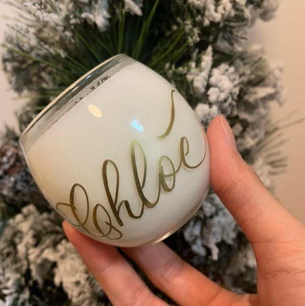 Bespoke calligraphy on a luxury acrylic surface with flowers